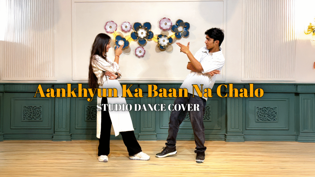 Dressed in expressive costumes, dancers perform an emotive choreography to a soulful track, captured mid-movement in a minimalistic studio setting.