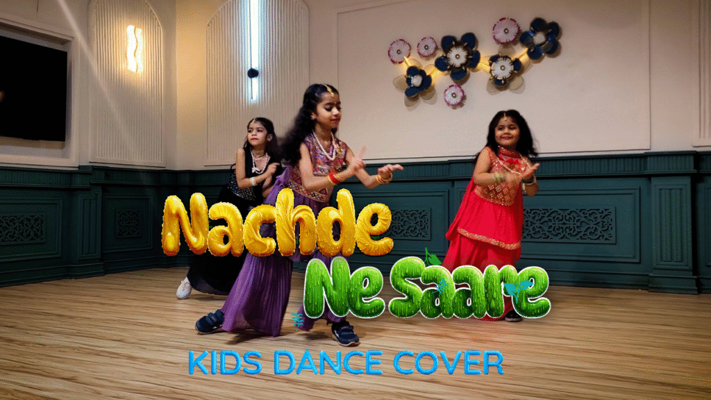 Three young girls performing a vibrant Indian dance routine in colorful costumes for "Nachde Ne Saare" kids dance cover.