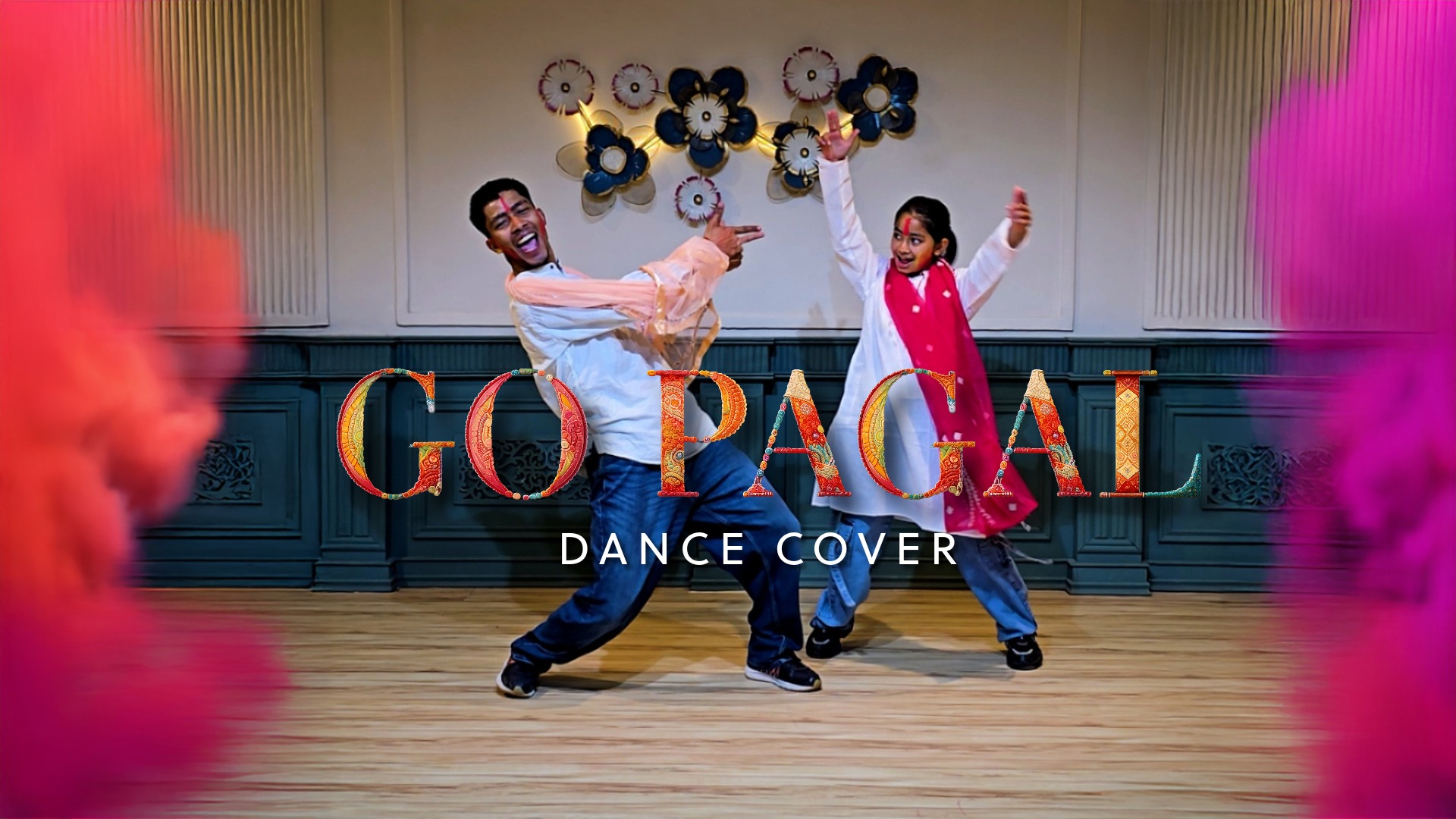 “Two dancers performing an energetic ‘Go Pagal’ dance cover in a studio with colorful powder effects and vibrant expressions.”
