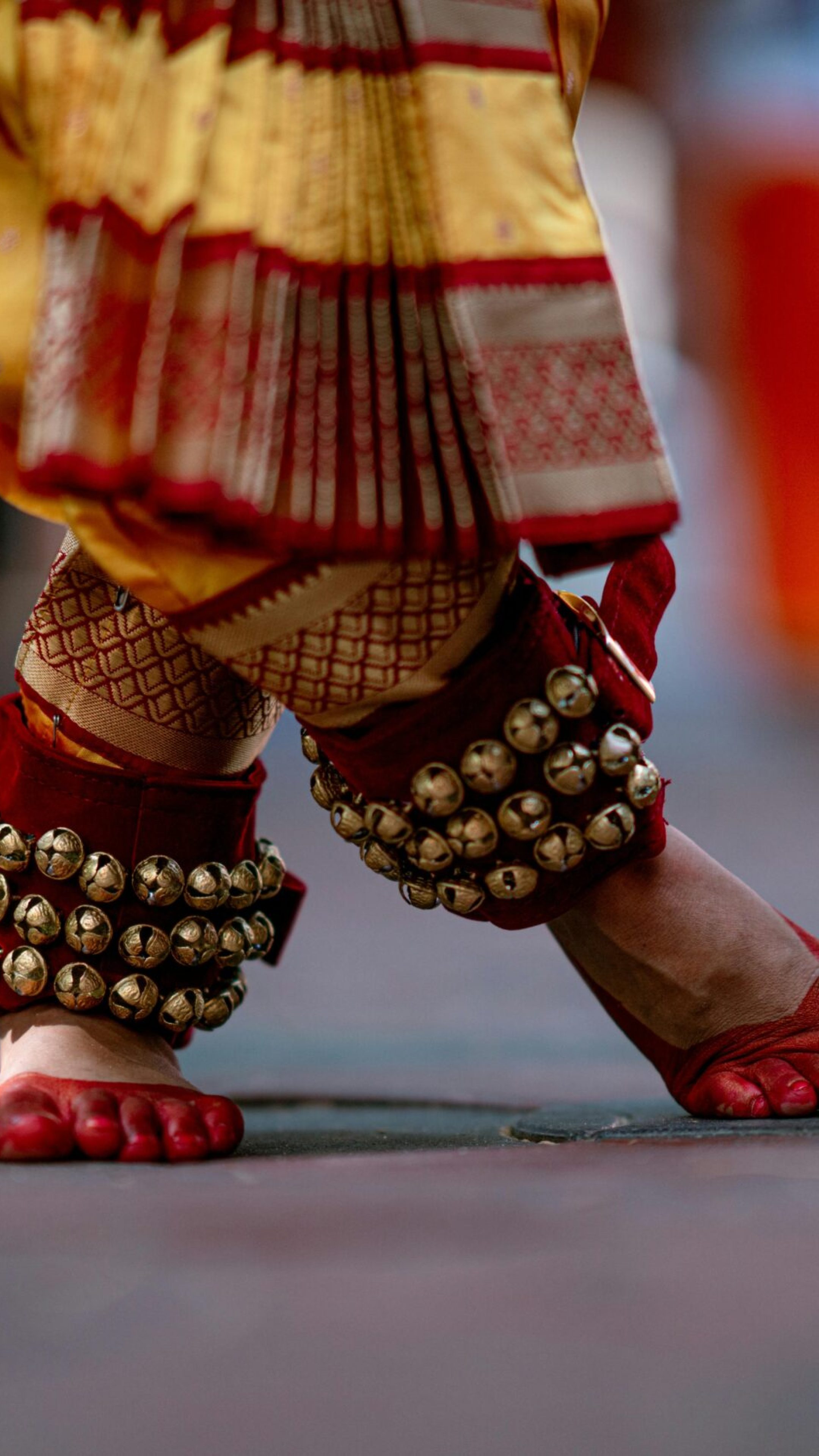 pexels-photo-30481585-30481585 Close-up of classical Indian dance footwork in Kerala attire with ghungroo anklets.